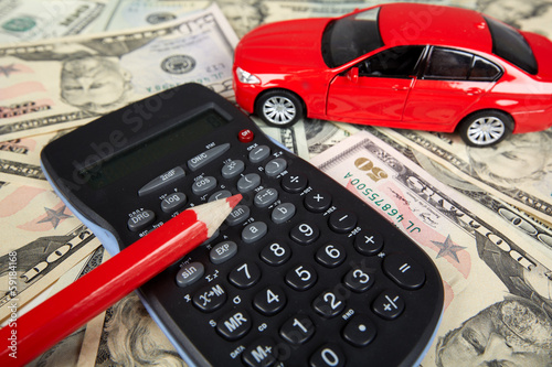 Photo: Car money and calculator. Car money and calculator.