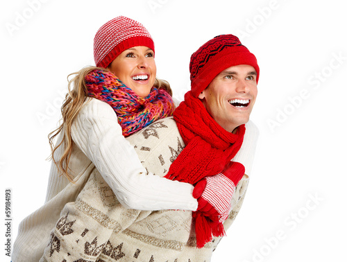 Photo: Happy christmas couple in winter clothing. Happy christmas couple in winter clothing.