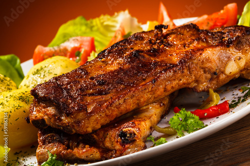 Photo: Tasty grilled ribs with vegetables Tasty grilled ribs with vegetables