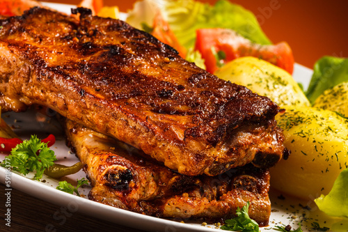 Photo: Tasty grilled ribs with vegetables Tasty grilled ribs with vegetables