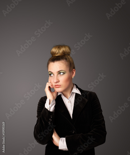 Photo: Young woman thinking with copy space Young woman thinking with copy space