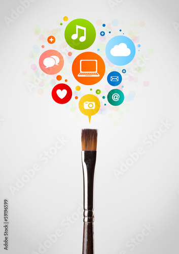 Photo: Brush close-up with social network icons Brush close-up with social network icons