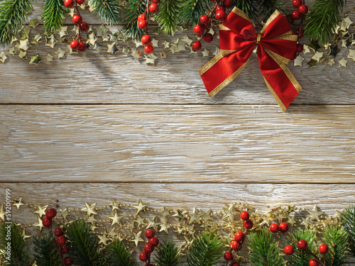 Photo: Christmas fir tree on wood texture. background old panels Christmas fir tree on wood texture. background old panels