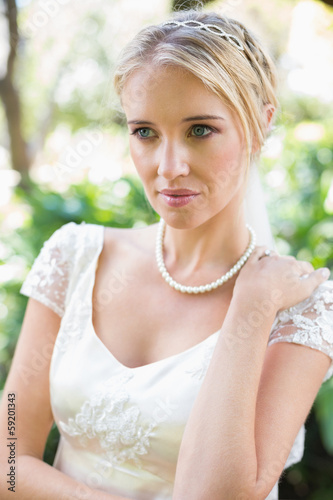 Photo: Smiling blonde bride in pearl necklace Smiling blonde bride in pearl necklace