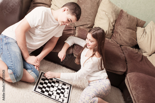 Photo: children with draughts at home children with draughts at home