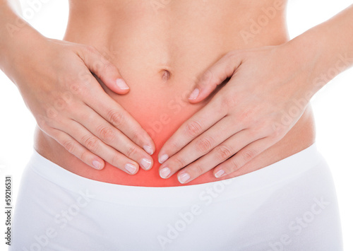 Photo: Woman Suffering From Stomach Ache Woman Suffering From Stomach Ache