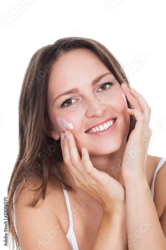 Photo: Woman Applying Moisturizer Cream Woman Applying Moisturizer Cream