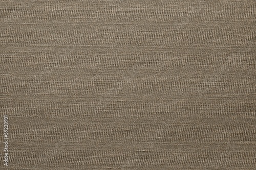 Photo: The granulated texture of a brown material The granulated texture of a brown material