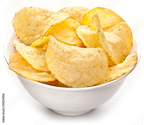 Photo: Potato chips in a bowl. Potato chips in a bowl.