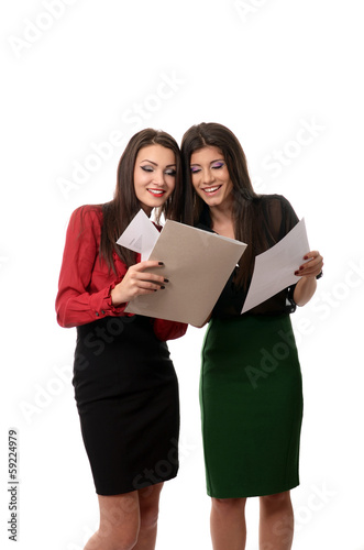 Photo: Business women doing paperwork Business women doing paperwork