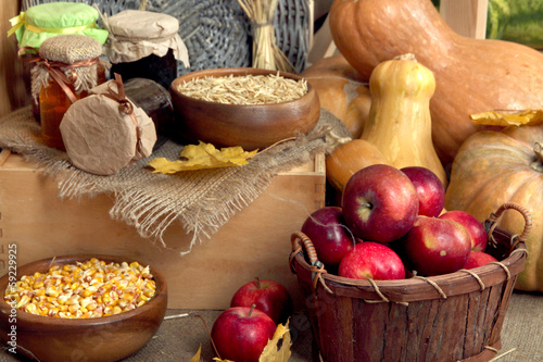 Photo: Fruits and vegetables with jars of jam and bowls of grains Fruits and vegetables with jars of jam and bowls of grains