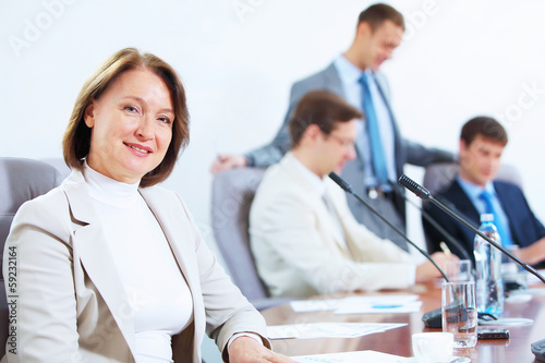 Photo: Four businesspeople at meeting Four businesspeople at meeting