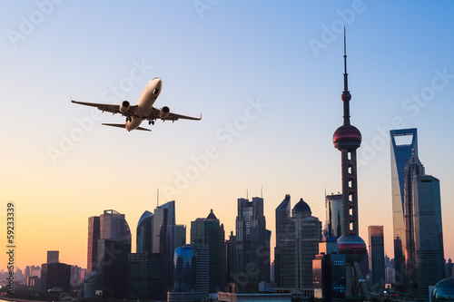 modern city skyline with airplane