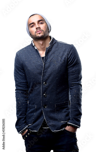 Photo: Stylish young man posing and looking at camera Stylish young man posing and looking at camera