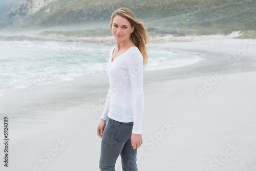 Photo: Portrait of a beautiful casual woman at beach Portrait of a beautiful casual woman at beach