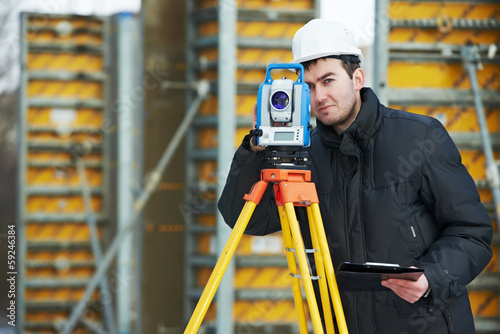 Photo: surveyor works with theodolite surveyor works with theodolite
