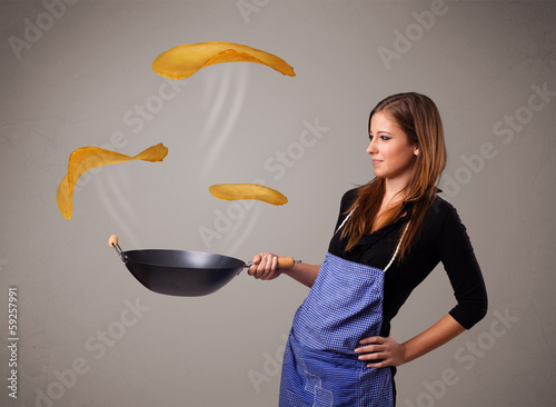 Photo: Woman making pancakes Woman making pancakes