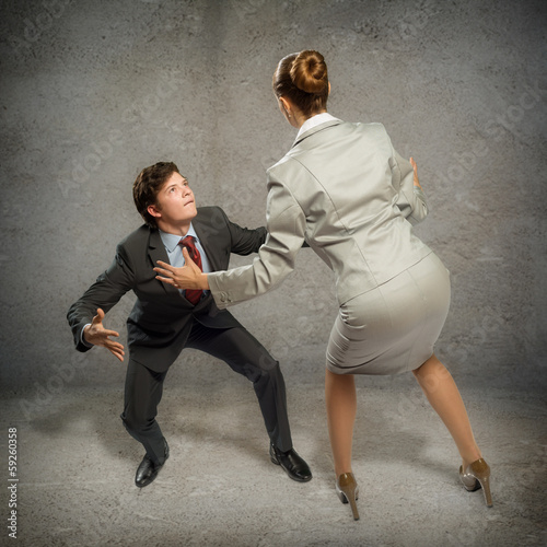 Photo: two businessmen fighting as sumoist two businessmen fighting as sumoist