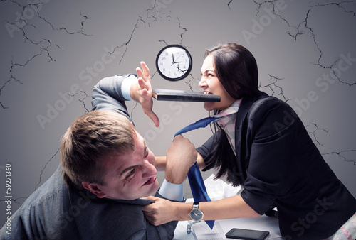 Photo: Two young caucasian office worker starting to fight Two young caucasian office worker starting to fight