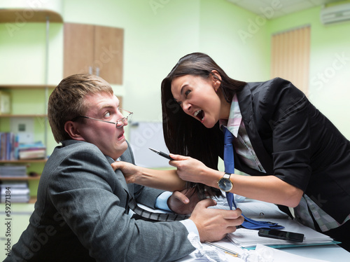Photo: Two young caucasian office worker starting to fight Two young caucasian office worker starting to fight