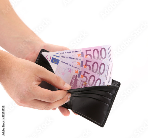 Photo: Purse with euro bills in hands. Purse with euro bills in hands.