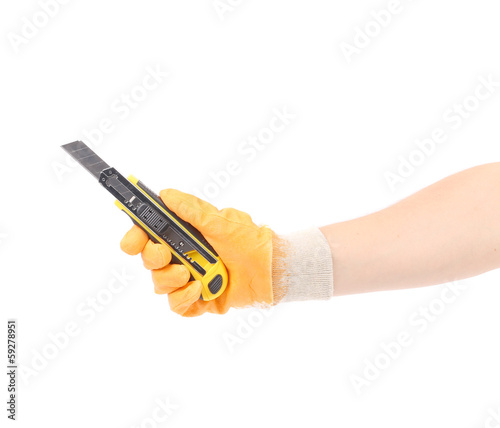 Photo: Hand in gloves holding knife. Hand in gloves holding knife.