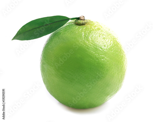 Photo: Ripe lime isolated on a white . Ripe lime isolated on a white .