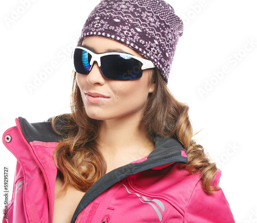 Photo: Young beautiful woman in winter clothes isolated on white Young beautiful woman in winter clothes isolated on white