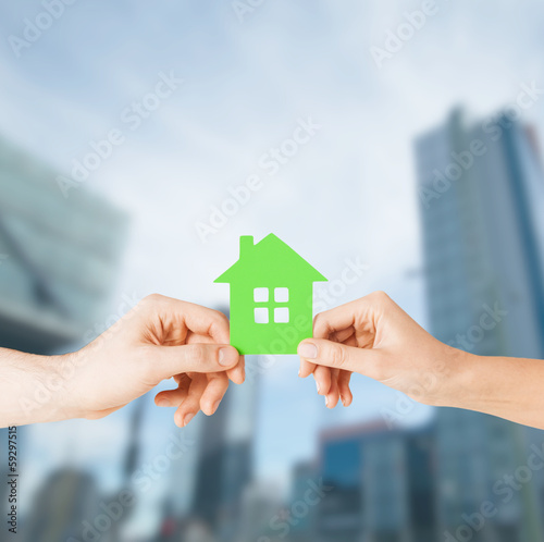 Photo: couple hands holding green house couple hands holding green house