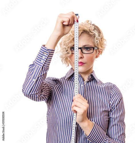 Photo: Young businesswoman with measurnig tape, isolated Young businesswoman with measurnig tape, isolated
