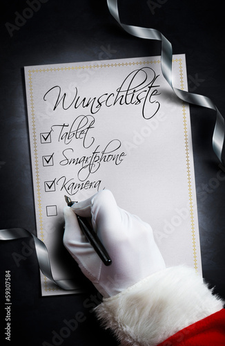 Photo: Santa hakt Wunschliste ab Santa hakt Wunschliste ab