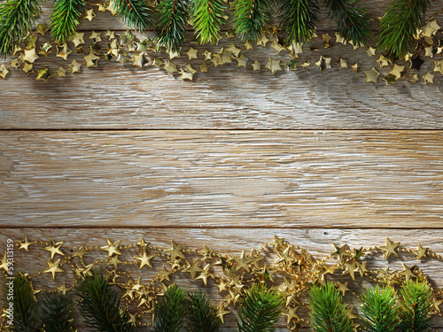 Photo: Christmas fir tree on wood texture. background old panels Christmas fir tree on wood texture. background old panels