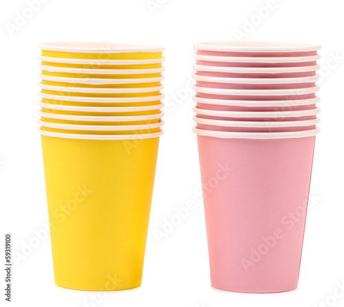 Photo: Two yellow and pink stacks of paper cups. Two yellow and pink stacks of paper cups.