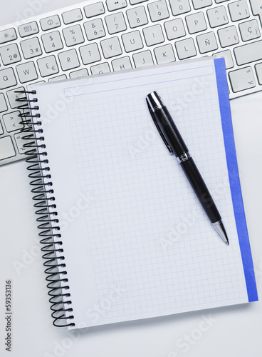 Photo: Notebook, keyboard and pen Notebook, keyboard and pen