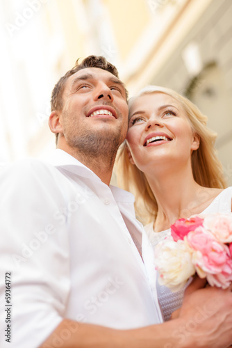 Photo: couple with flowers in the city couple with flowers in the city