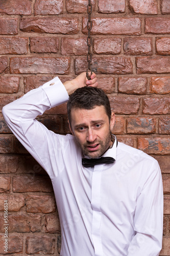 Photo: Desperate man with a chain around his neck Desperate man with a chain around his neck