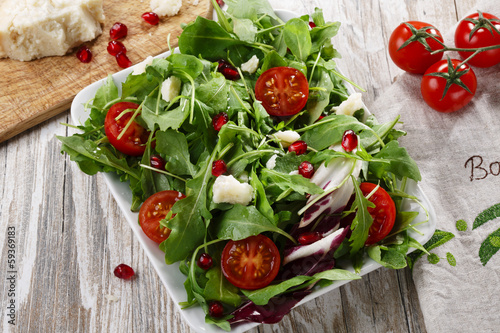 Photo: salad with Parmesan cheese and pomegranate salad with Parmesan cheese and pomegranate