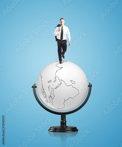 Photo: businessman on globe businessman on globe