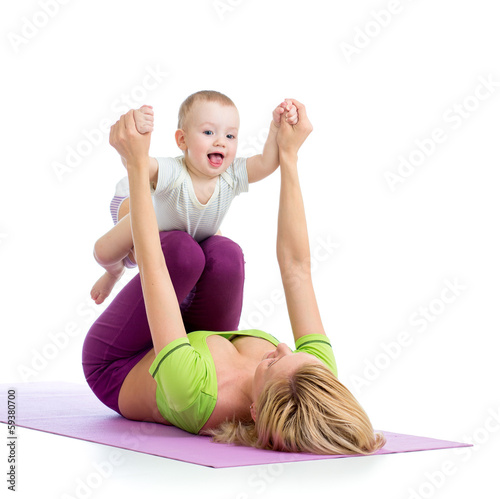 Photo: mother with baby boy doing gymnastics mother with baby boy doing gymnastics