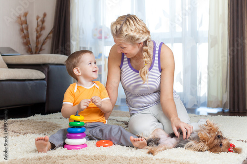 Photo: mother and kid have pastime together indoor mother and kid have pastime together indoor