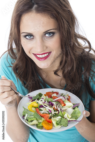 Photo: Young Woman Eating Stir Fried Vegetables Young Woman Eating Stir Fried Vegetables