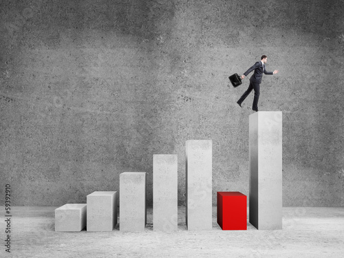 Photo: man jumping on graph man jumping on graph