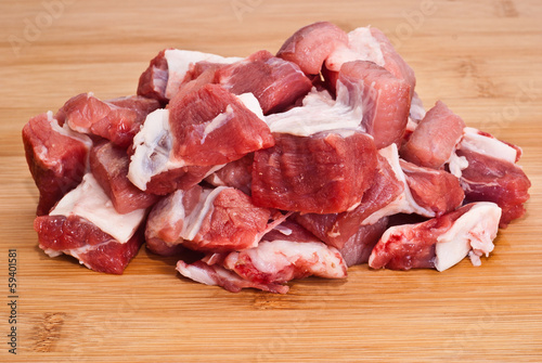 Photo: Raw beef on wooden board Raw beef on wooden board