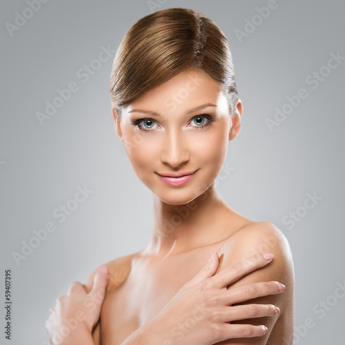Photo: Beautiful young woman with perfect skin Beautiful young woman with perfect skin