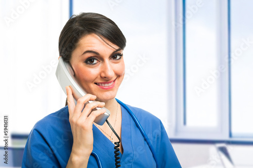 Photo: Nurse talking on the phone Nurse talking on the phone