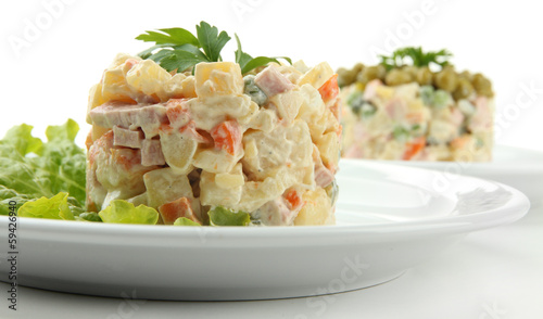 Photo: Russian traditional salad Olivier, isolated on white Russian traditional salad Olivier, isolated on white