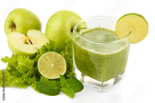 Photo: Glass of green vegetable juice apple and lime close up Glass of green vegetable juice apple and lime close up