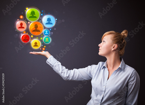 Photo: Social network icons in the hand of a businesswoman Social network icons in the hand of a businesswoman