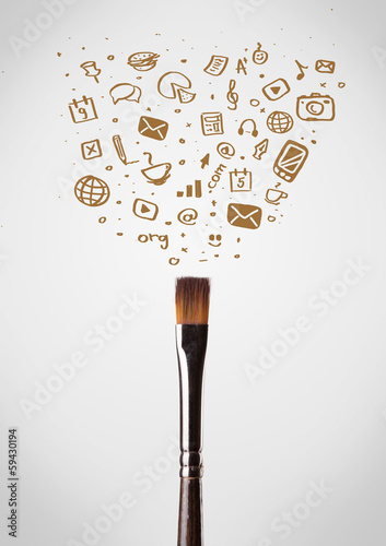 Photo: Brush close-up with social media icons Brush close-up with social media icons