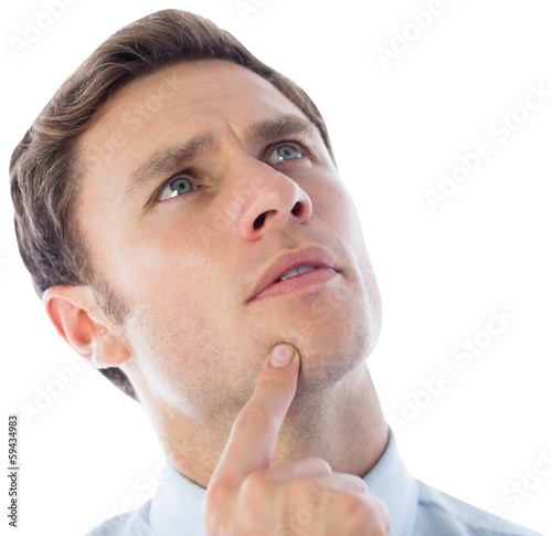 Photo: Thinking businessman with finger on chin Thinking businessman with finger on chin